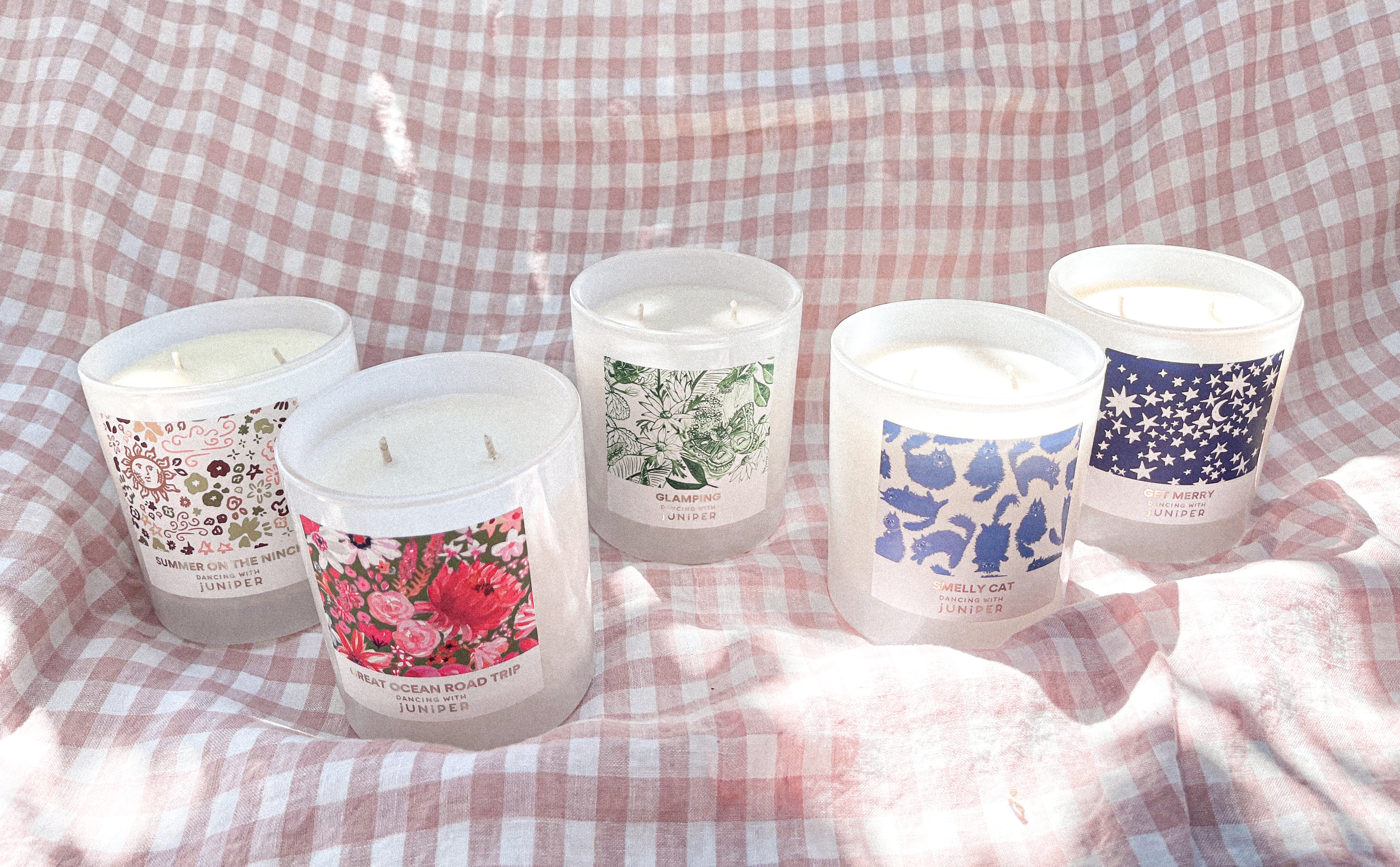New lead free cotton wick scented soy candle collection with pretty artist designed packaging on gingham backdrop