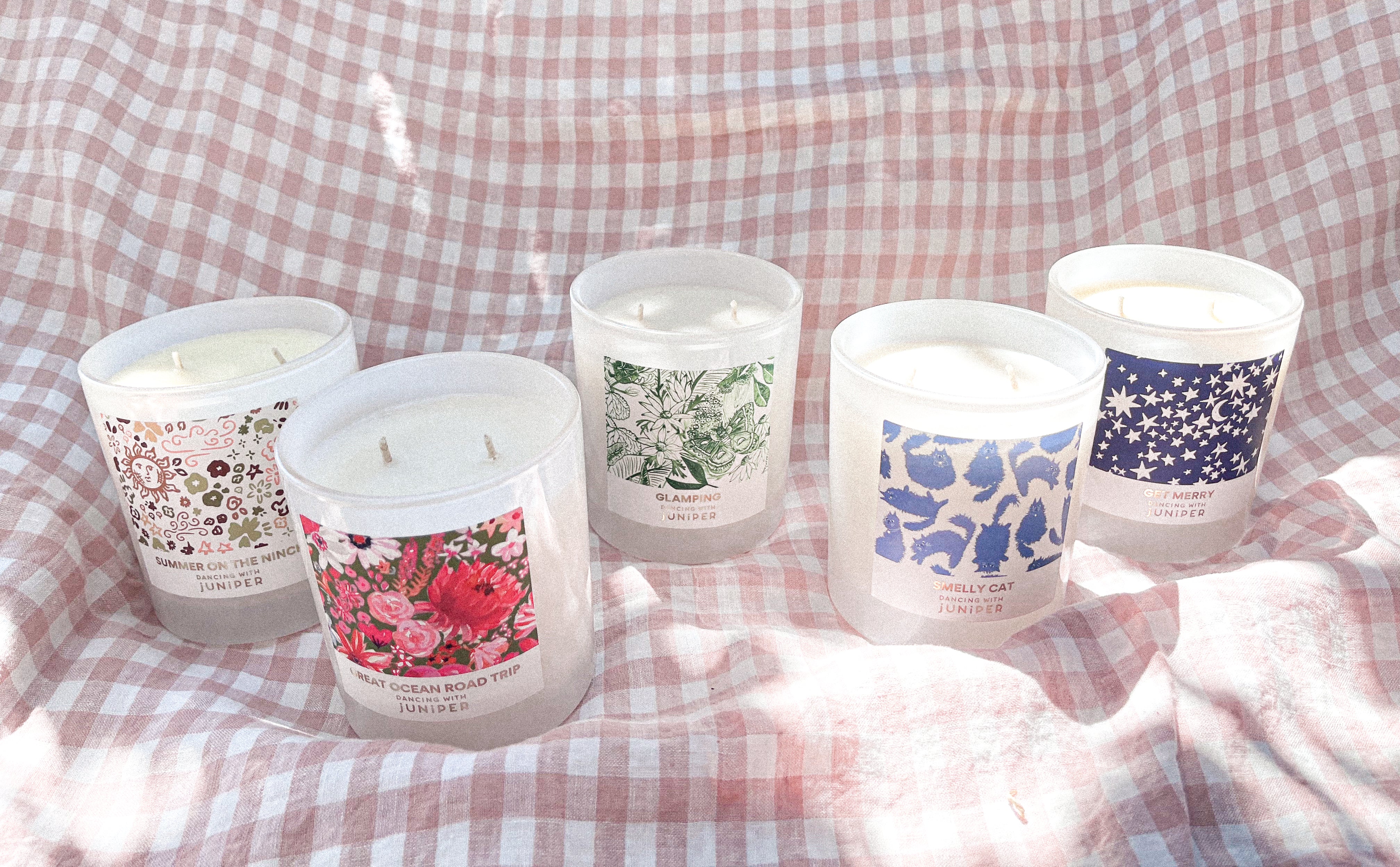 New lead free cotton wick scented soy candle collection with pretty artist designed packaging on gingham backdrop